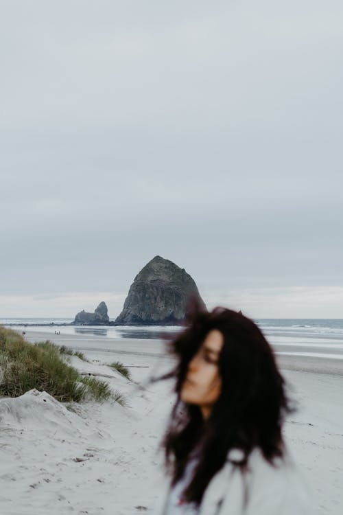 Blur Photo of Woman on Seashore 