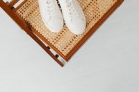 Leather low tops on a cane seat — photo by Kaboompics on Pexels