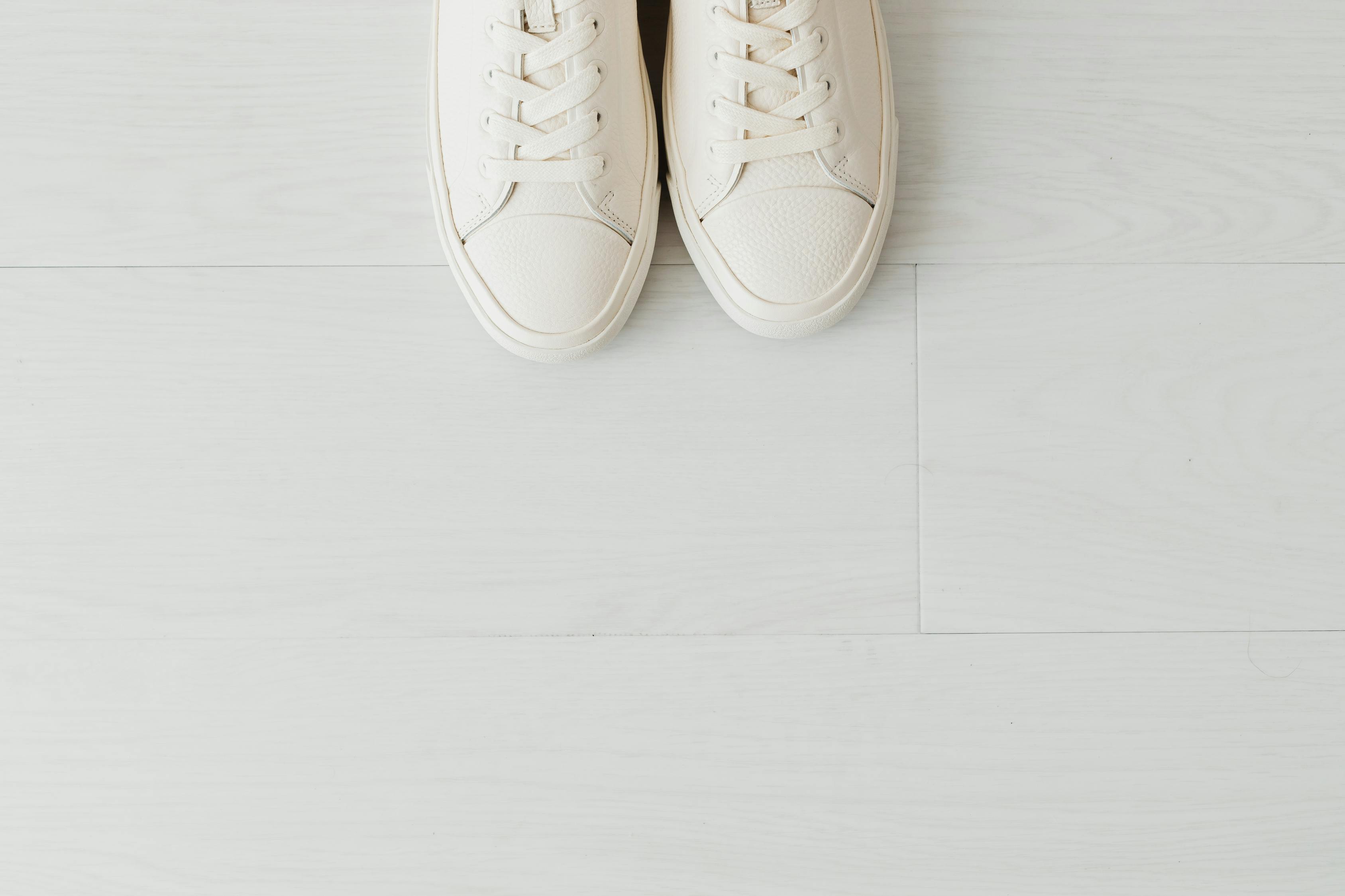 White Leather Shoes on White Floor Tiles · Free Stock Photo