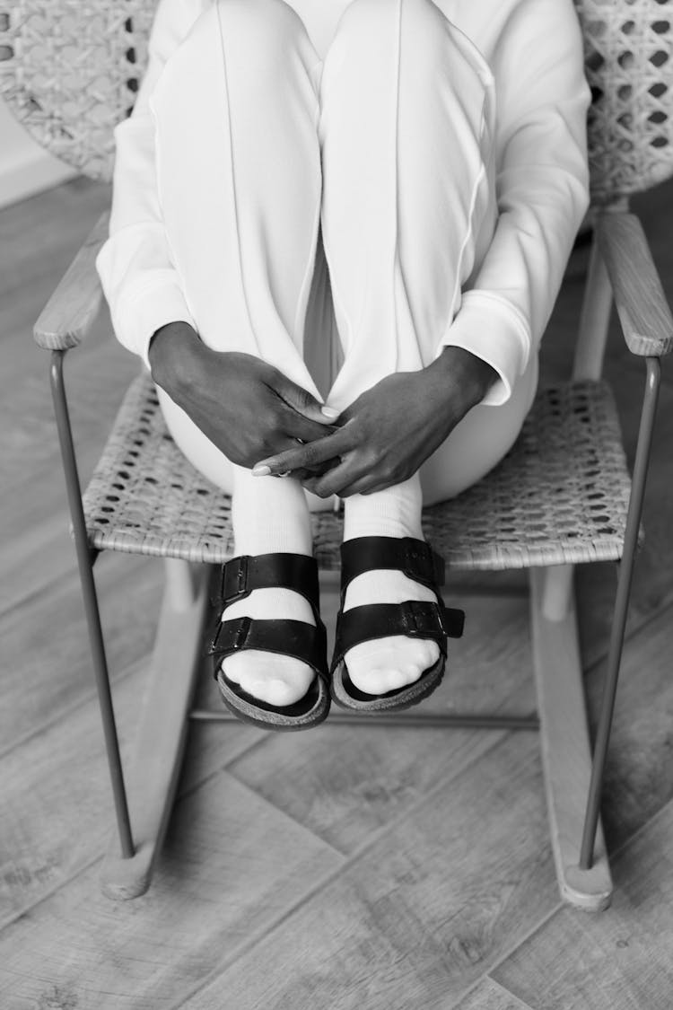 Black And White Photo Of A Woman In White Socks And Sandals