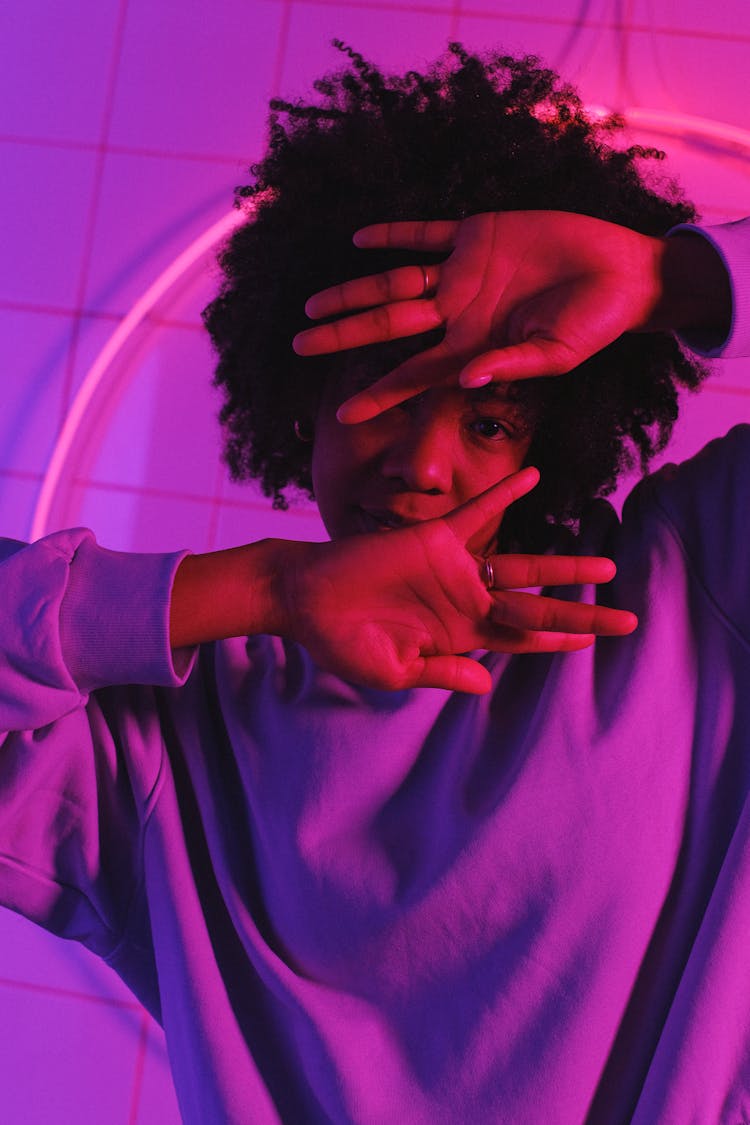 Black Female Dancing In Studio With Neon Lights