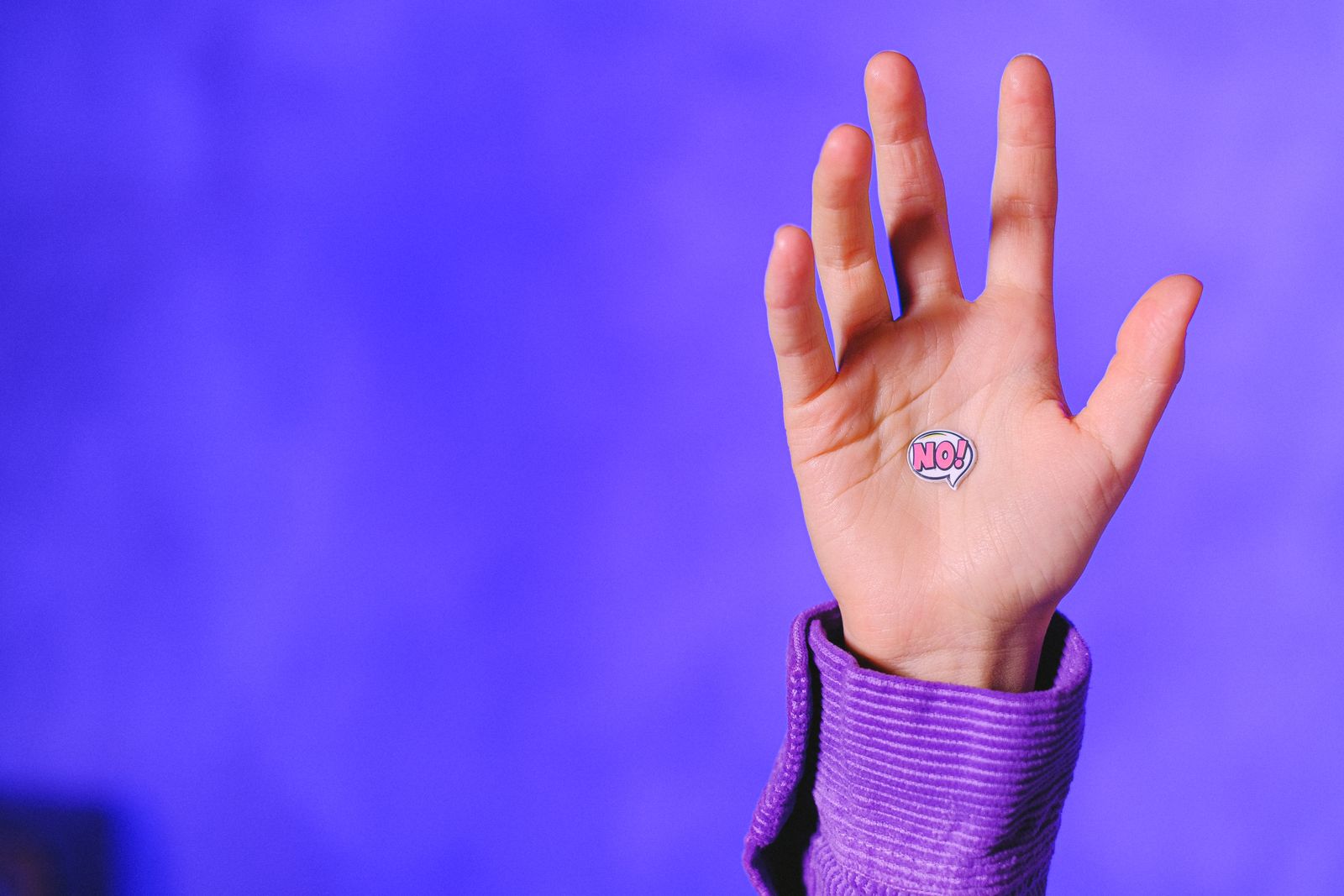 Person measuring their hand and wrist for thumb spica splint sizing