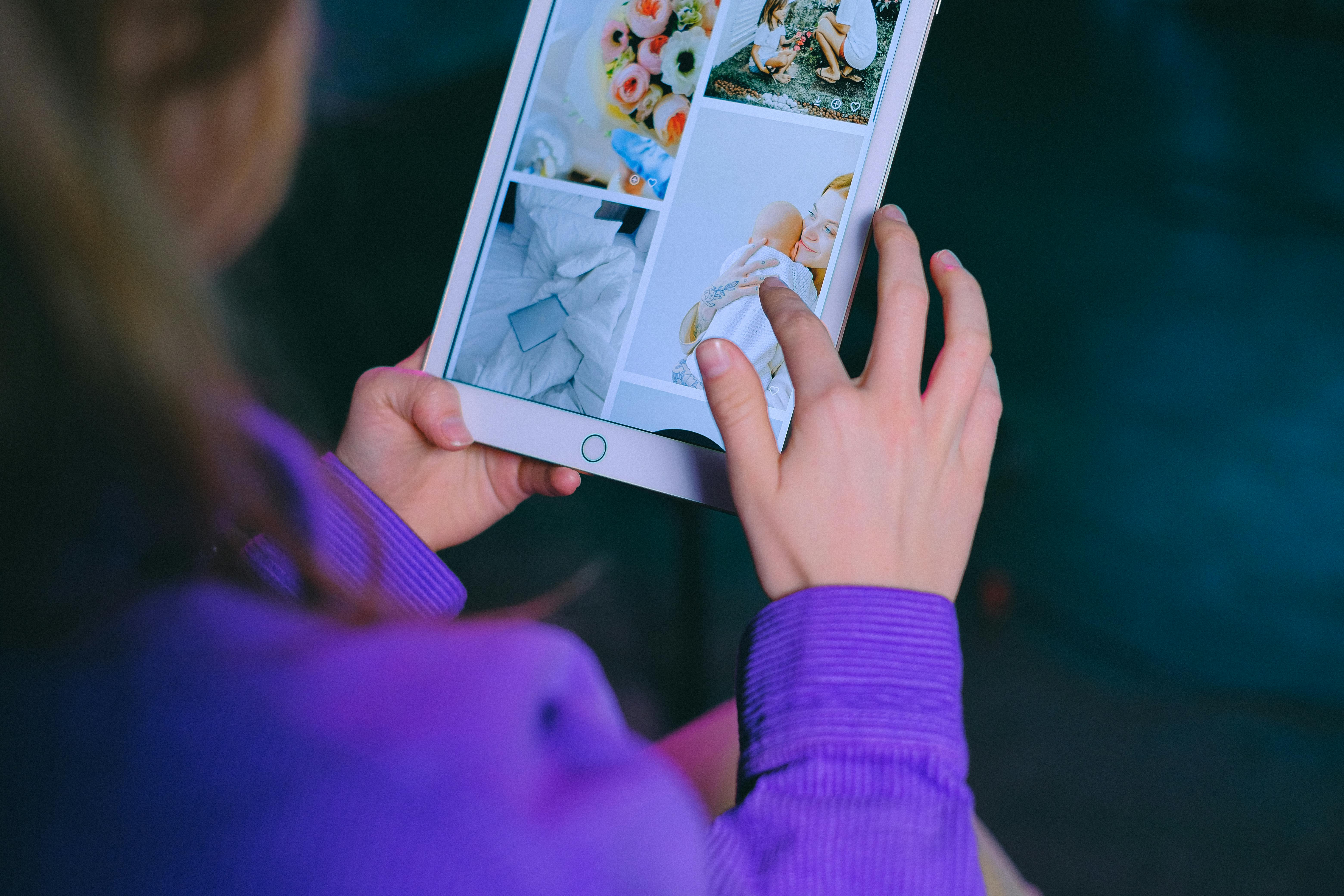 unrecognizable woman browsing modern tablet