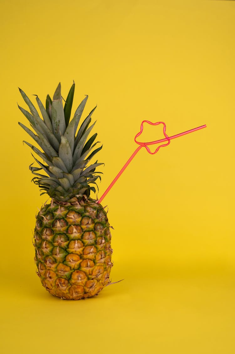 Ripe Pineapple With Cocktail Straw