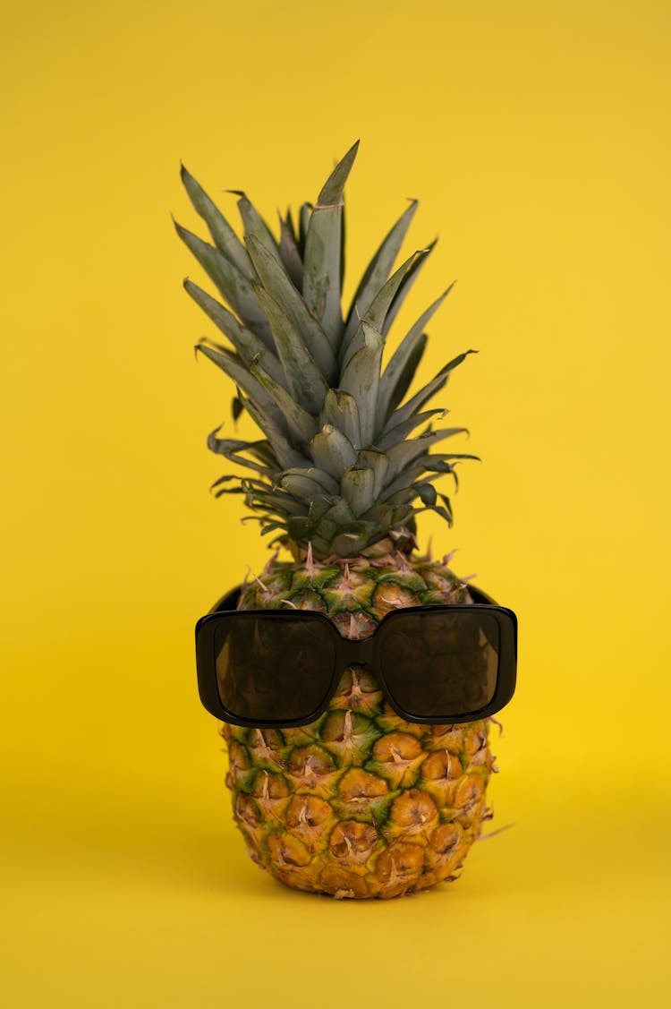 Ripe Pineapple With Sunglasses In Studio