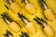 Backdrop of ripe pineapple halves with sweet flesh