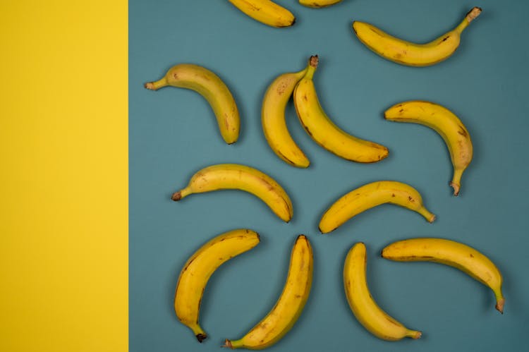 Yummy Fresh Bananas On Two Color Background