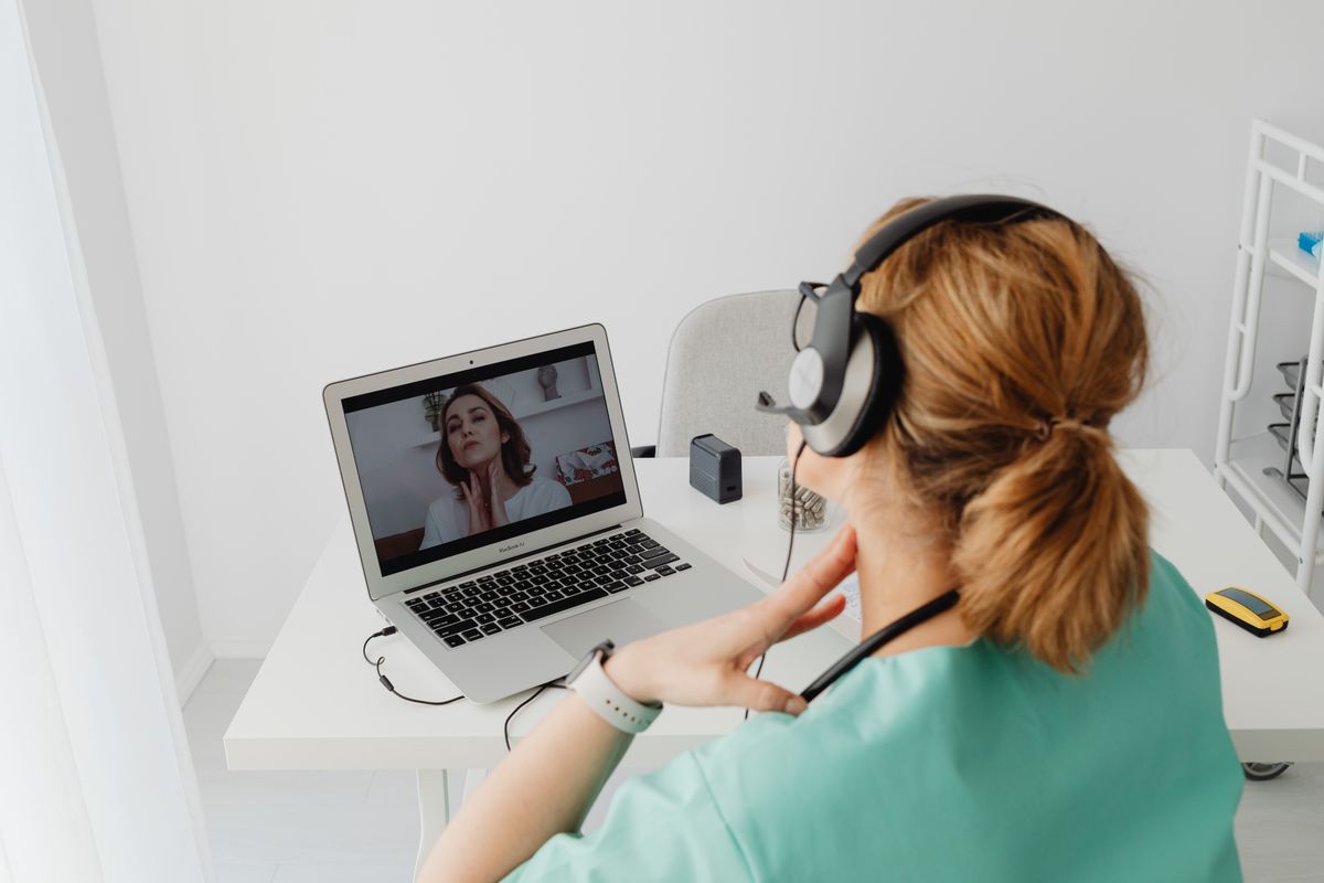 Patient online consultation with doctor on laptop