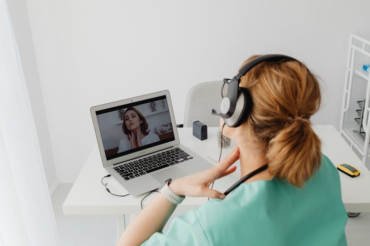 Patient Having An Online Appointment With A Doctor Using Laptop 