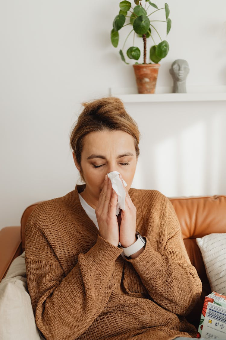 Woman Blowing Nose