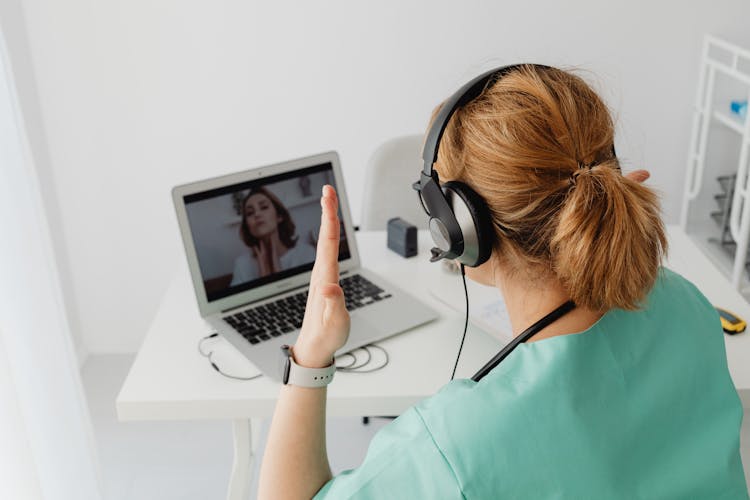 Doctor Communicating With A Patient Via Internet