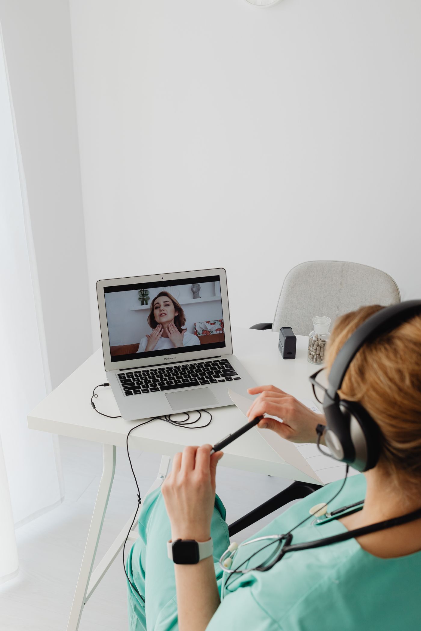 Patient using a laptop for a telepsychiatry appointment with a mental health provider