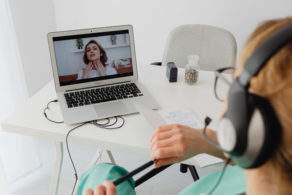 Healthcare professional conducting a video consultation with a patient online