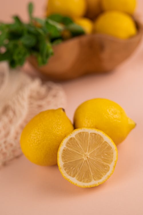 Yellow Lemon Fruit on a Pink Surface