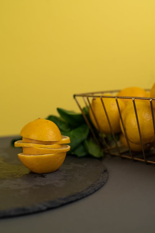 Yellow Lemon Fruit on a Black Surface