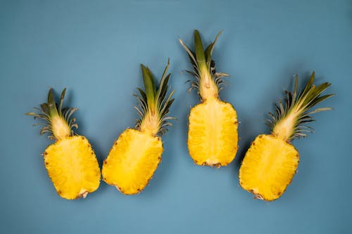 Free Delicious pineapple on blue surface Stock Photo