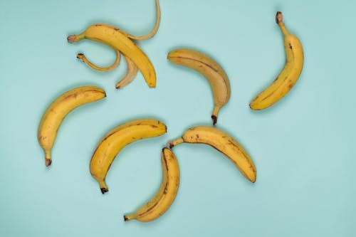 Backdrop of fresh bananas with spots on peel