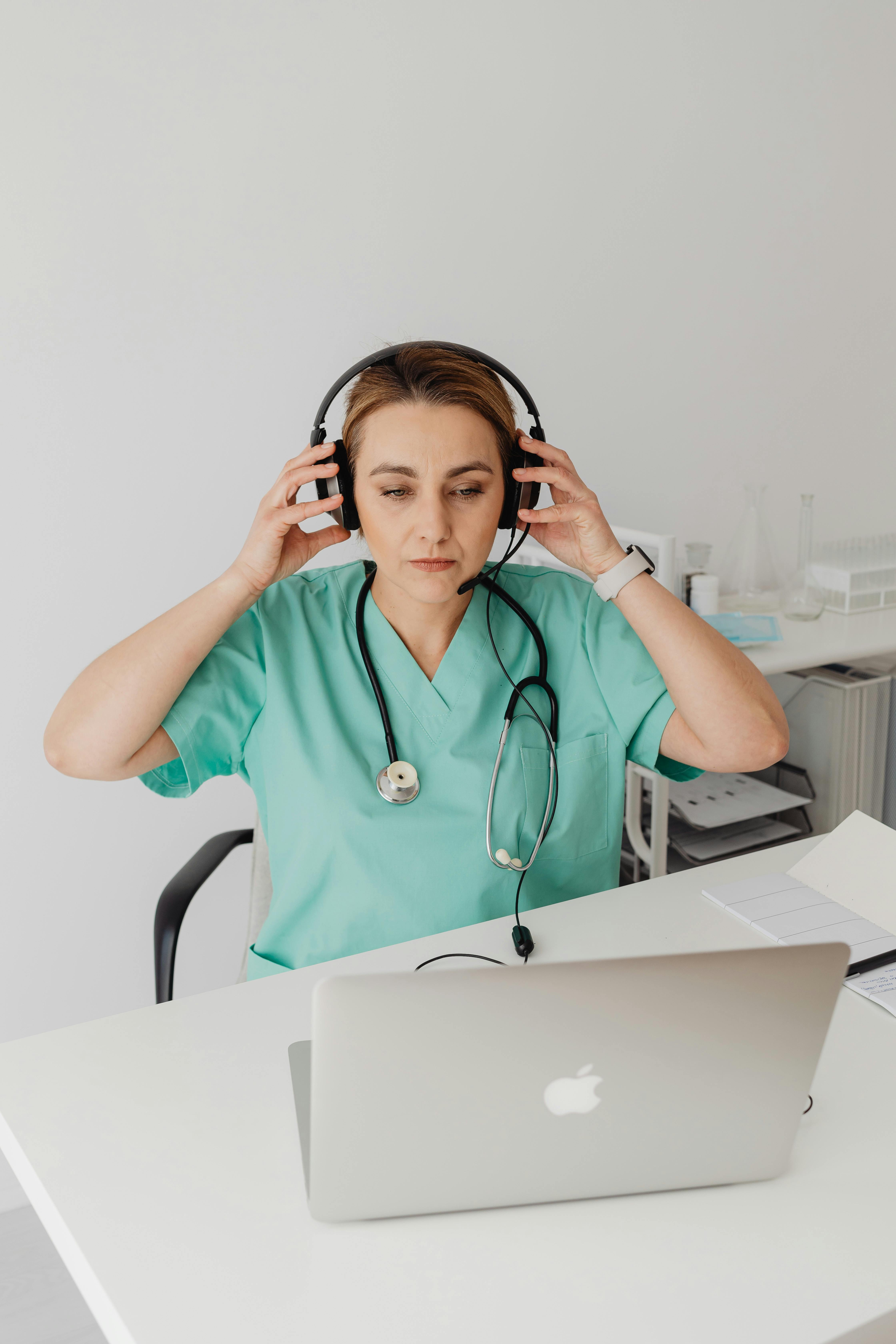 a female doctor using a laptop