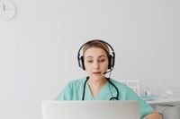 Professional physiotherapist conducting an online consultation