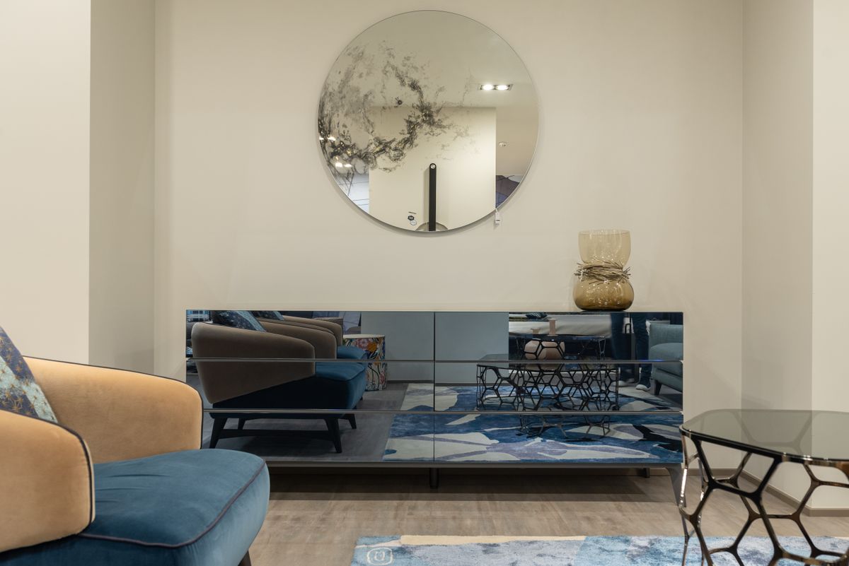 Modern luxury room with armchair, table, mirror and elegant furniture