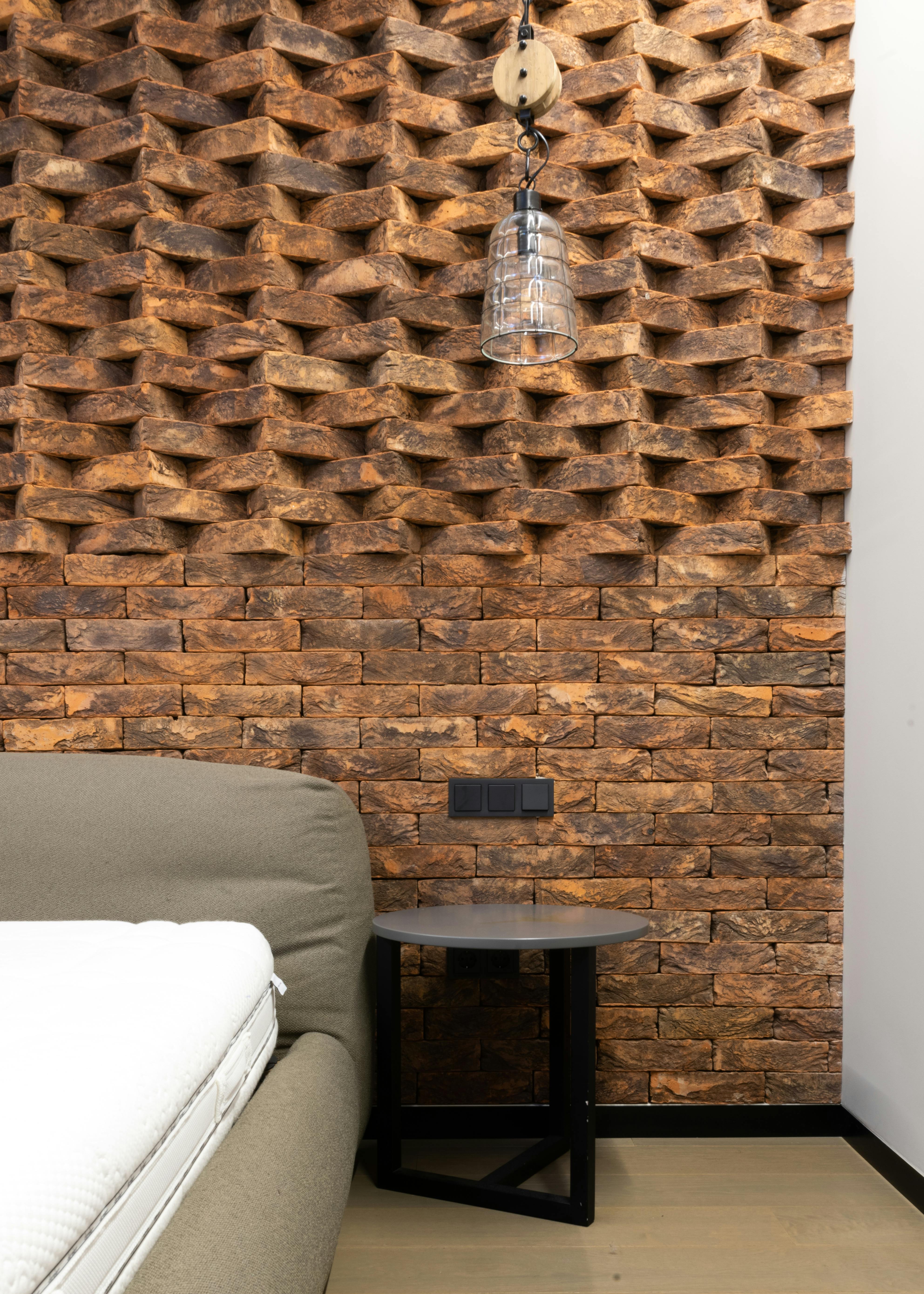 interior details of modern loft style bedroom with creative brick wall