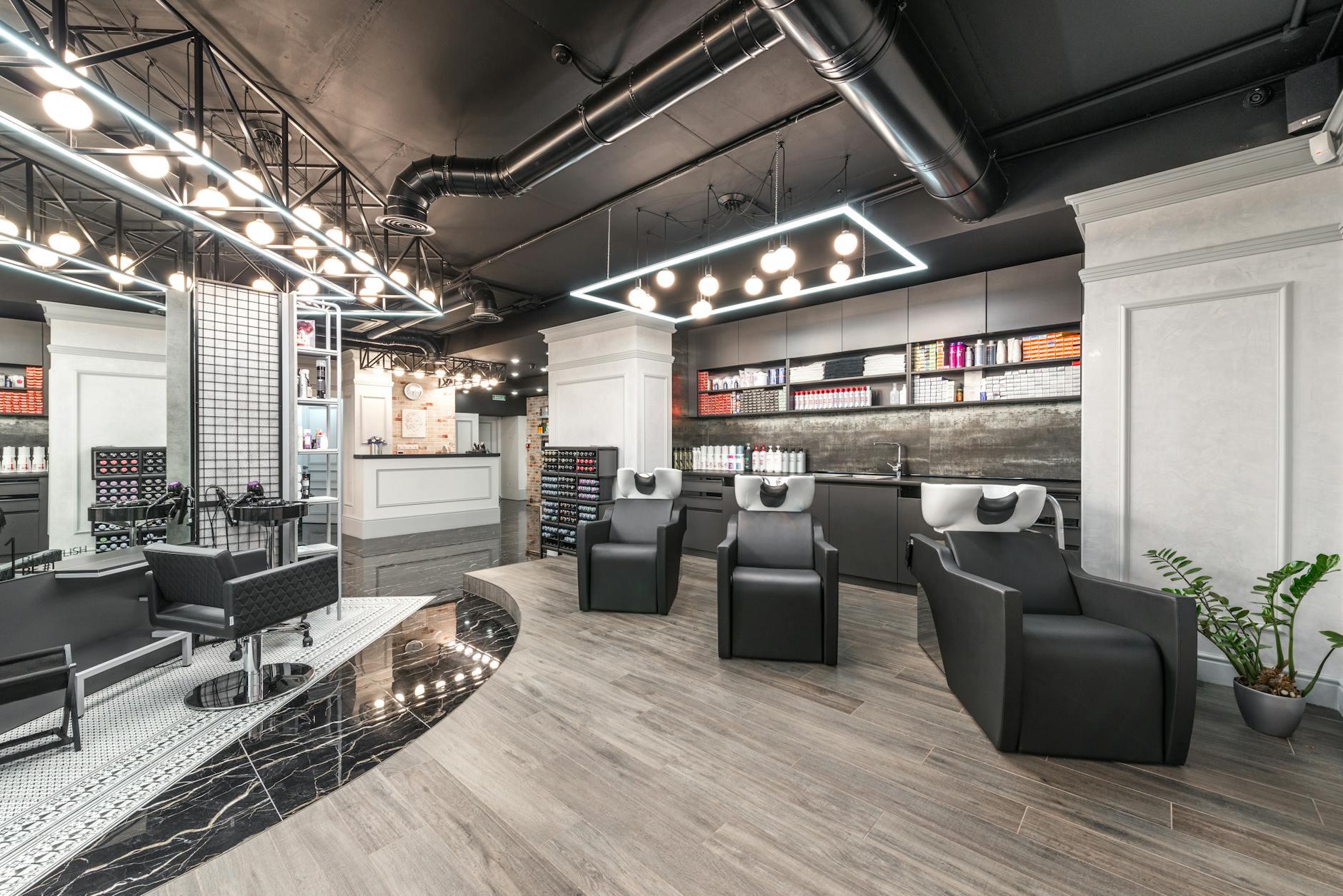 Contemporary hair salon interior showcasing modern decor and styling equipment.