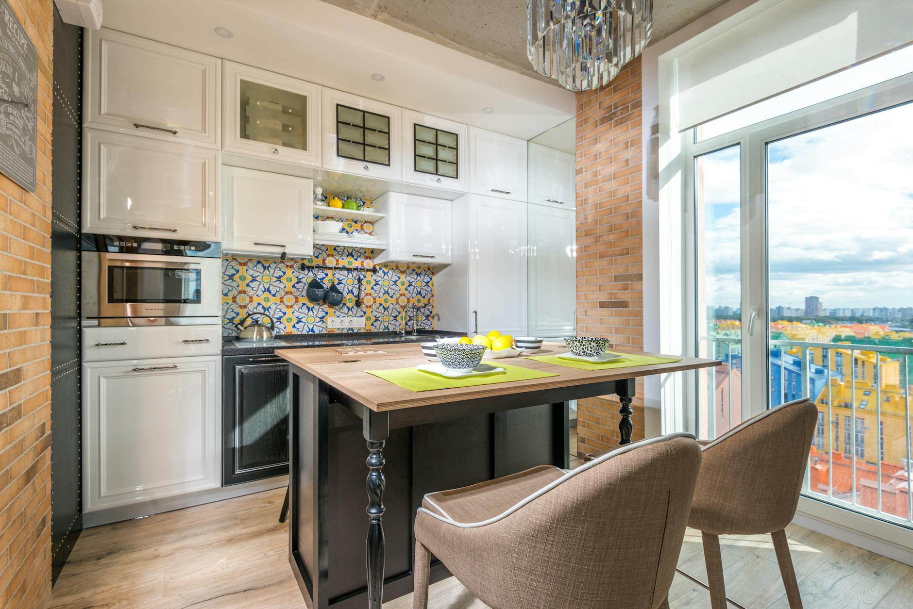 A kitchen with cabinets stretching till ceiling