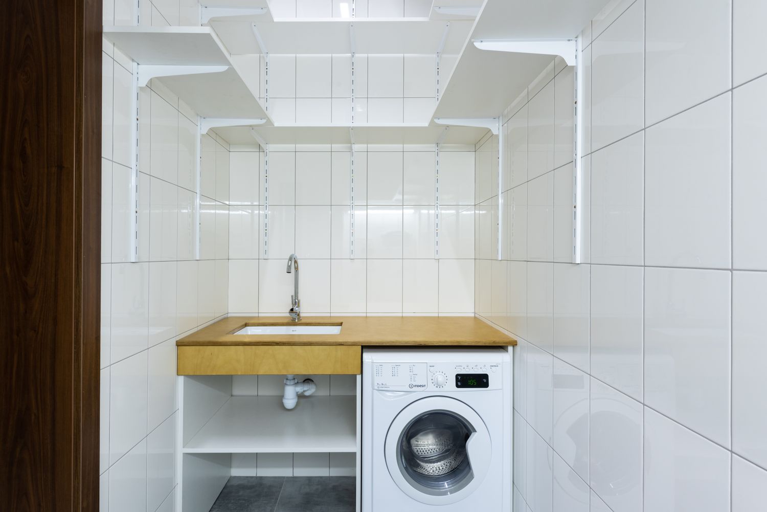Modern laundry area with washing machine in a home