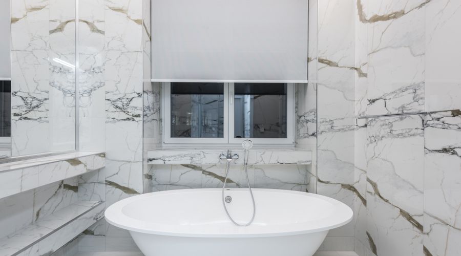 Freestanding bathtub installation in Laguna Hills bathroom remodel