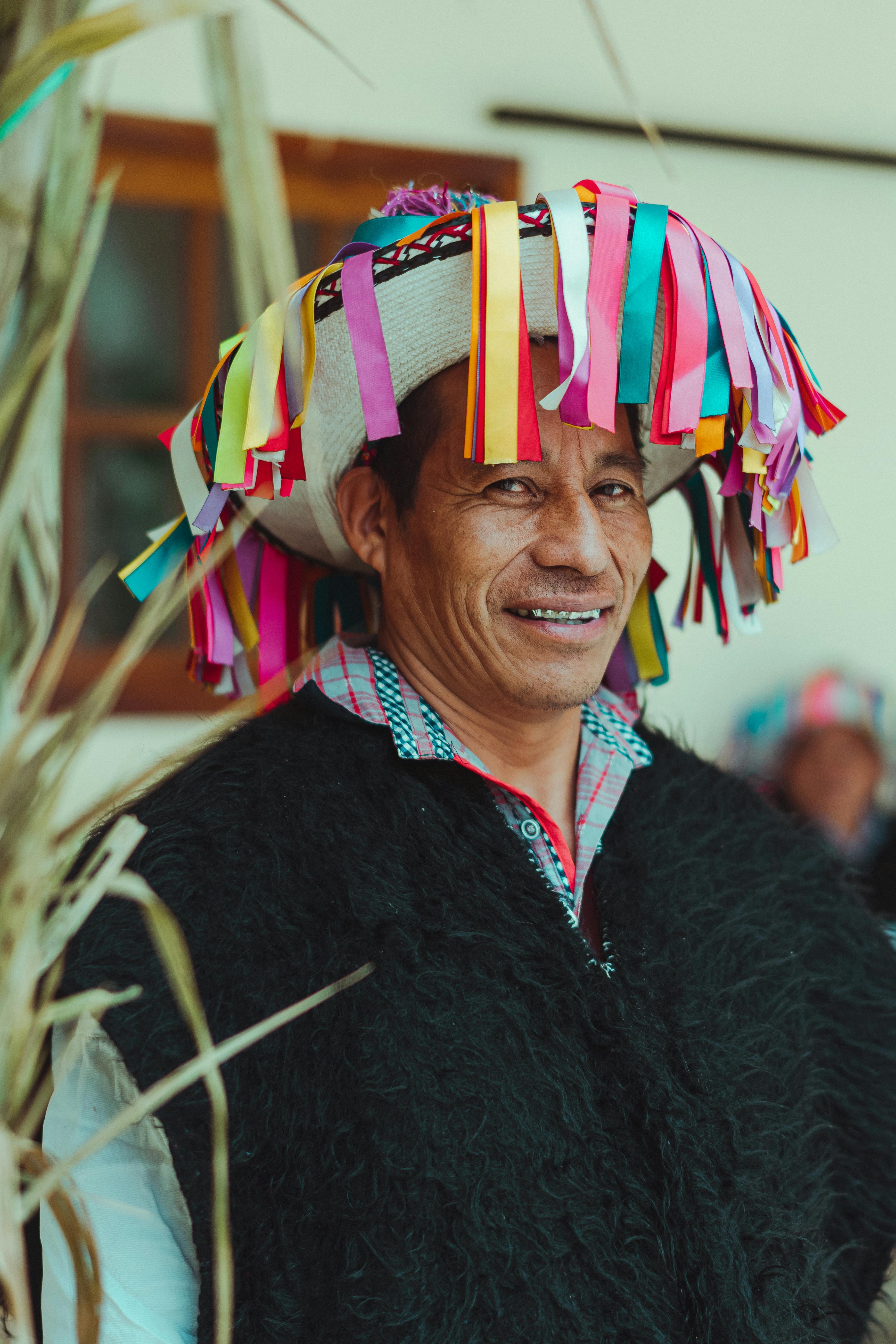 photo of man wearing black fur poncho