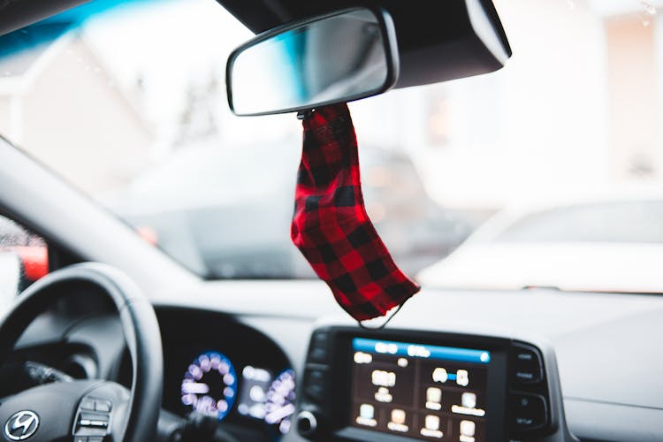 Mask Hanging On Mirror In Car