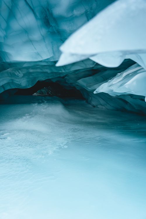 Free Explore the serene beauty of a frozen ice cave in Zermatt, Switzerland, showcasing pristine icy formations. Stock Photo