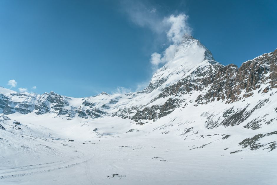 Stunning winter landscape of the Matterhorn in Zermatt, Switzerland, under a clear blue sky.