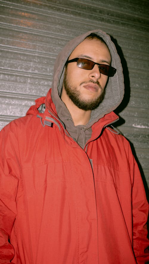 A Man Wearing Sunglasses and a Jacket 