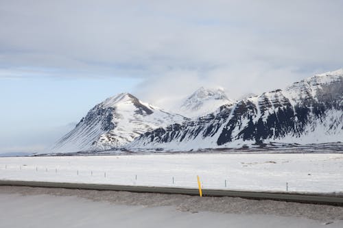 Road Near a Snow Covered Mountains