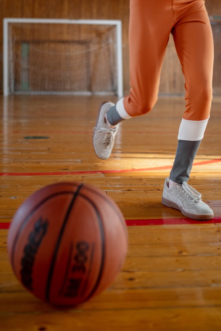 A Basketball On Wooden Flooring