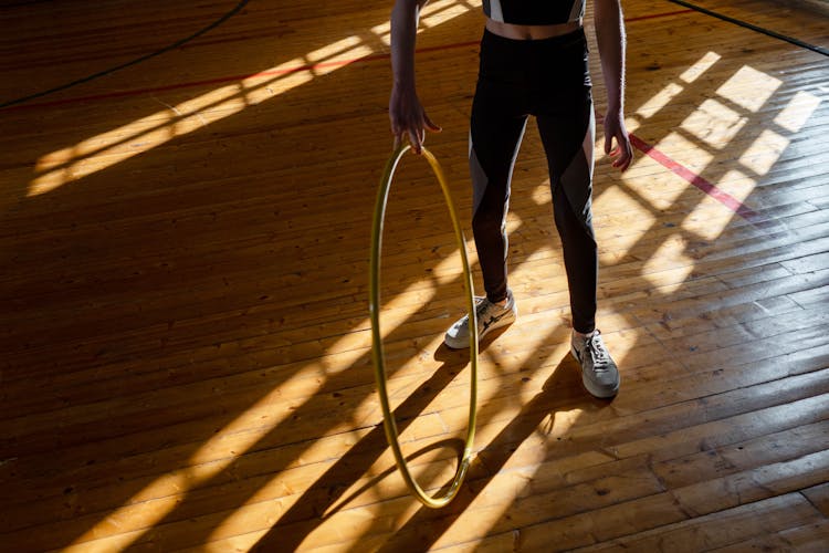 A Person Holding A Hula Hoop