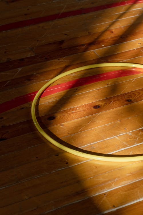 Hula Hoop on the Wooden Floor Lit by Daylight