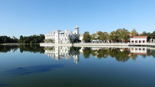 Stunning view of elegant lakeside buildings reflecting in the water in Celebration, Florida.