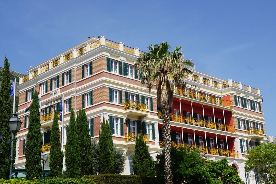 Stunning exterior view of a hotel with vibrant balconies showcasing hospitality architecture