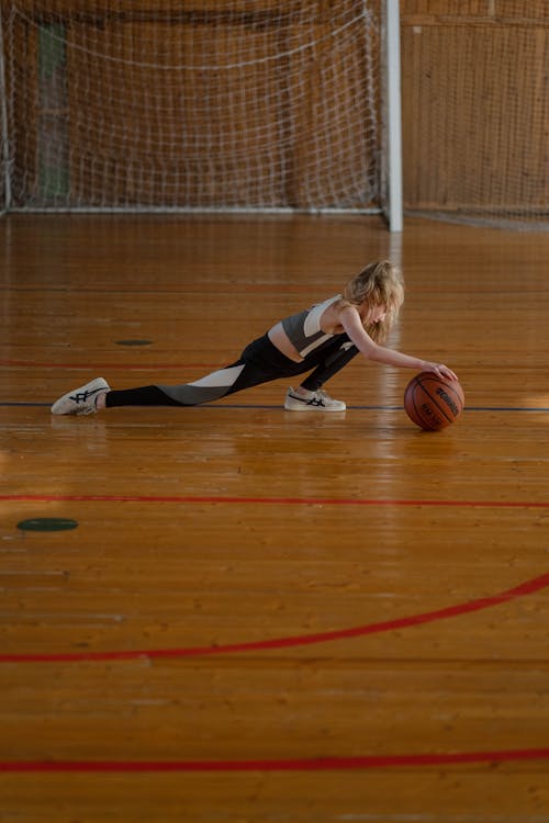 Free A Girl Playing with a Basketball Stock Photo