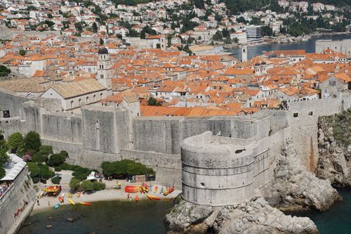 Free Explore the historic city walls of Dubrovnik, Croatia with stunning aerial views and vibrant rooftops. Stock Photo