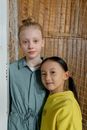 Boy in Blue Button Up Shirt Beside Girl in Yellow Shirt