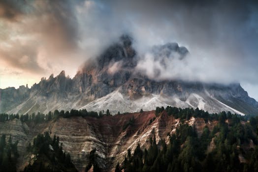 Breathtaking view of foggy Dolomites at dawn, perfect for nature and adventure themes.