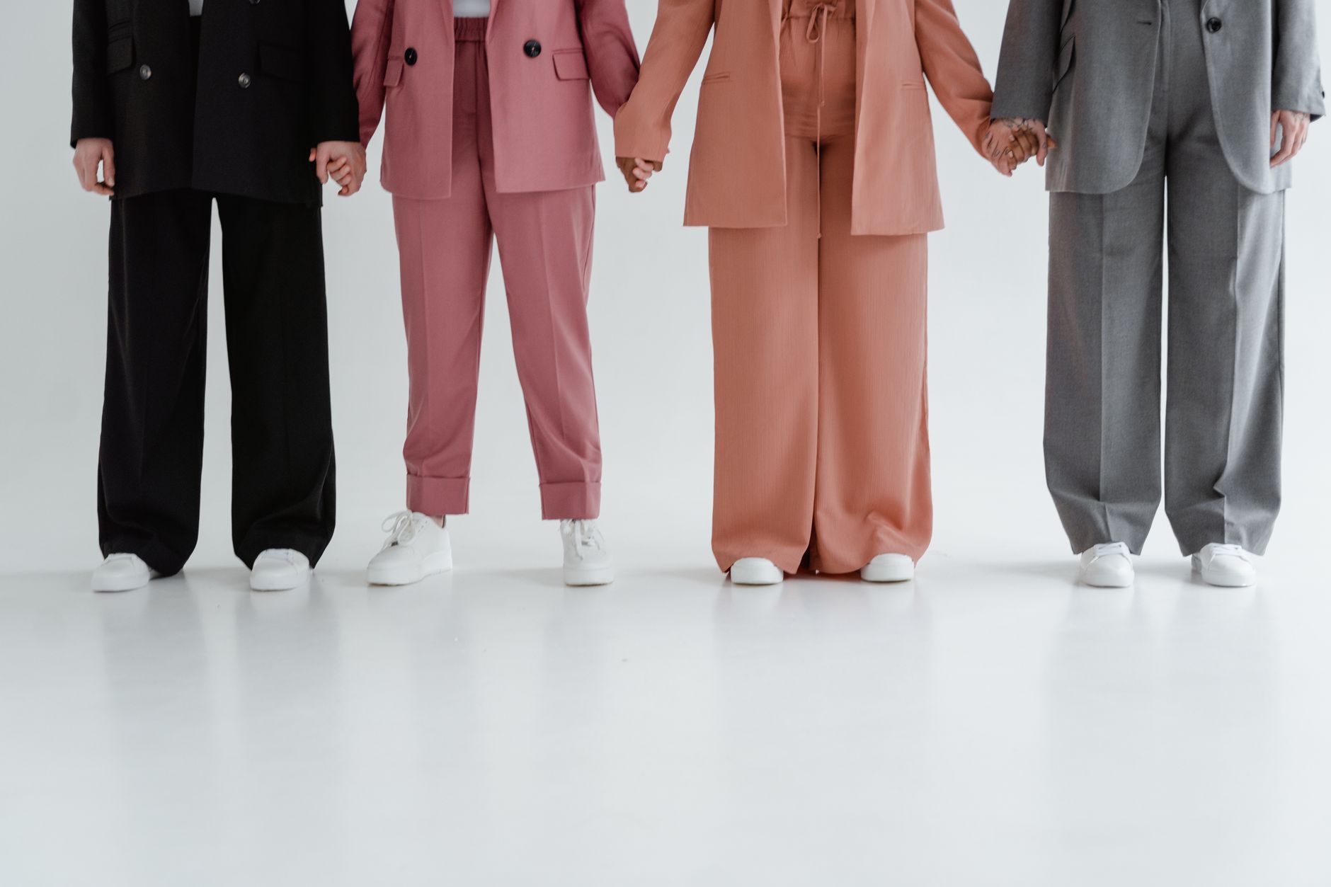 completed dress-code versatility scoring rubric showing four trouser cuts scored across four professional contexts SOURCE: Pexels
