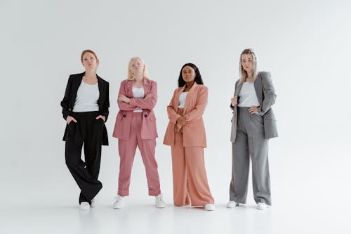 Women in Business Coats on White Background