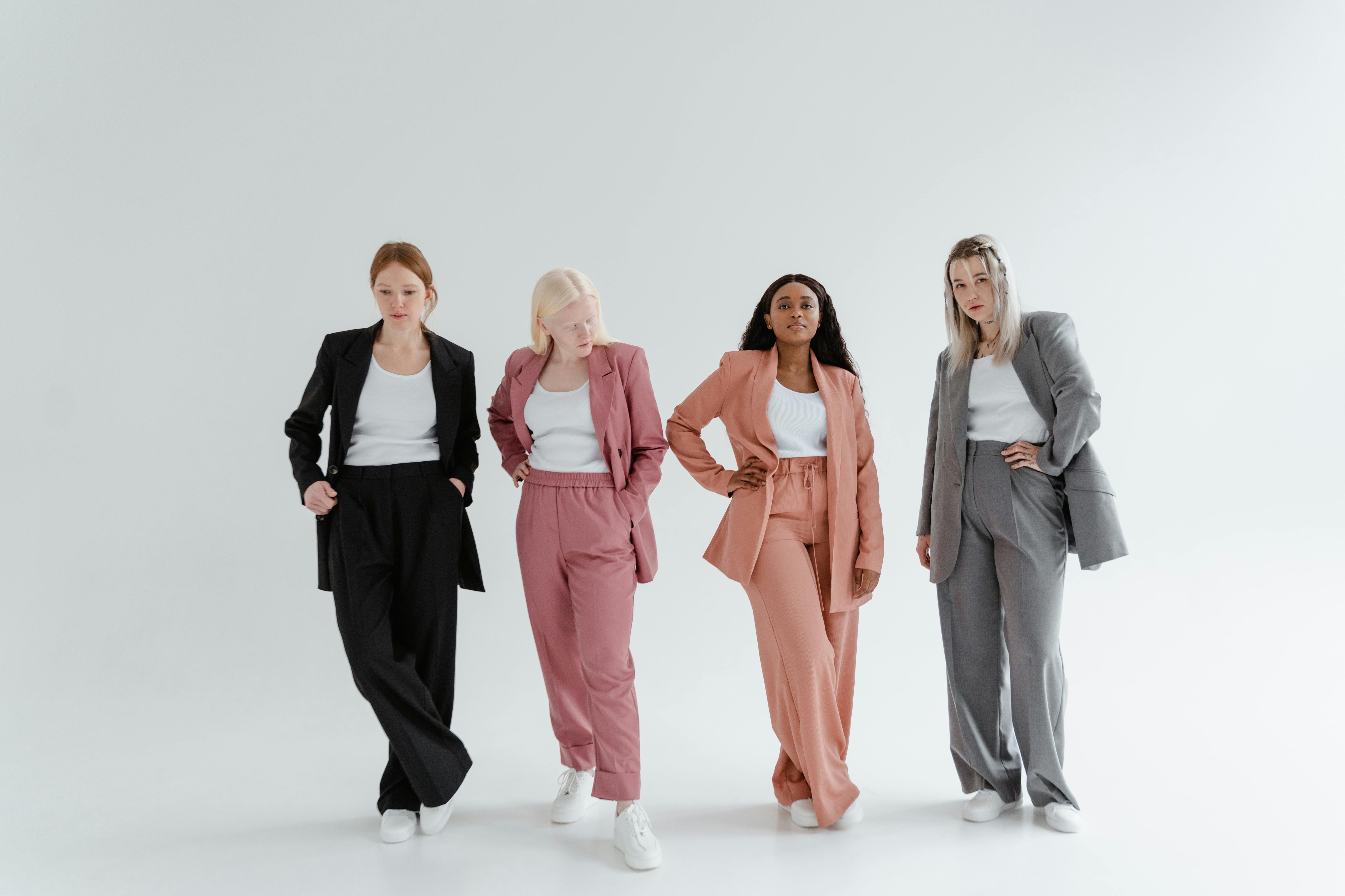 women posing on a white background