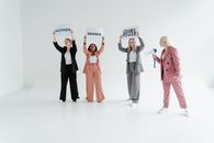 3 Women and 2 Men Standing on White Floor