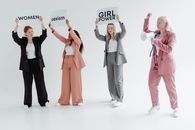 A Group of Women Standing Together while Protesting