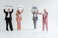 A Group of Women Wearing Blazers and Suits while Protesting